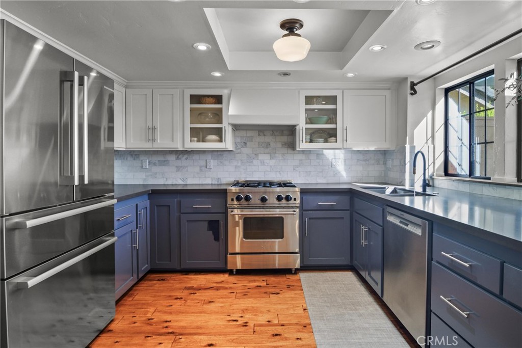 279 Tempus Circle Arroyo Grande, CA 93420 - Photo 9 of 38 a kitchen with stainless steel appliances granite countertop a stove sink and cabinets