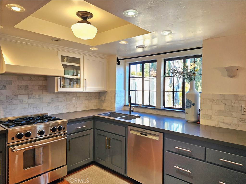 279 Tempus Circle Arroyo Grande, CA 93420 - Photo 10 of 38 a kitchen with a sink stove and cabinets
