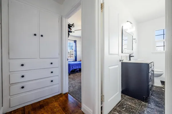 a view of room with cabinet and mirror