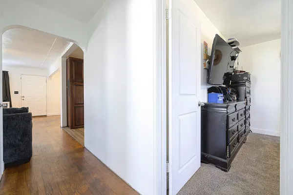 a view of a kitchen from the hallway