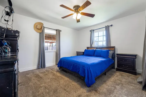 a bedroom with a bed and a closet