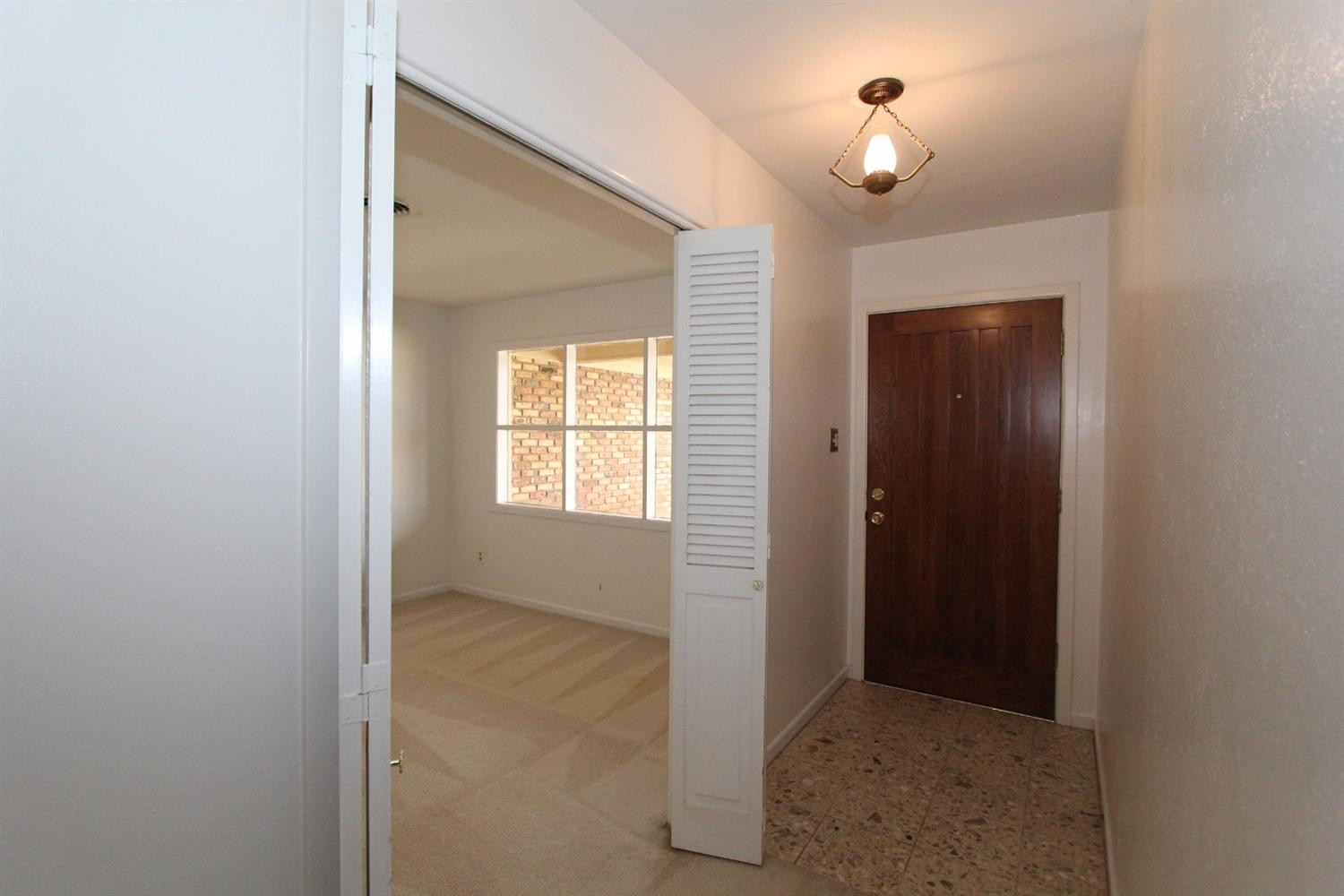 4711 27th Street Lubbock, TX 79410 - Photo 3 of 10 an empty room that has a window