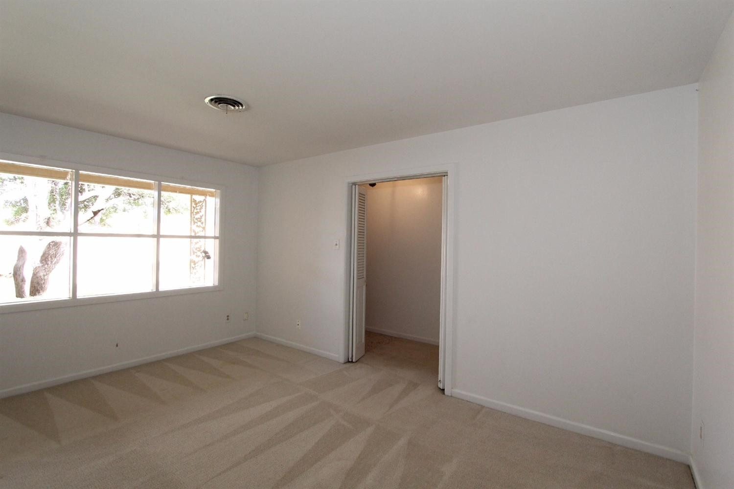 4711 27th Street Lubbock, TX 79410 - Photo 5 of 10 an empty room with windows