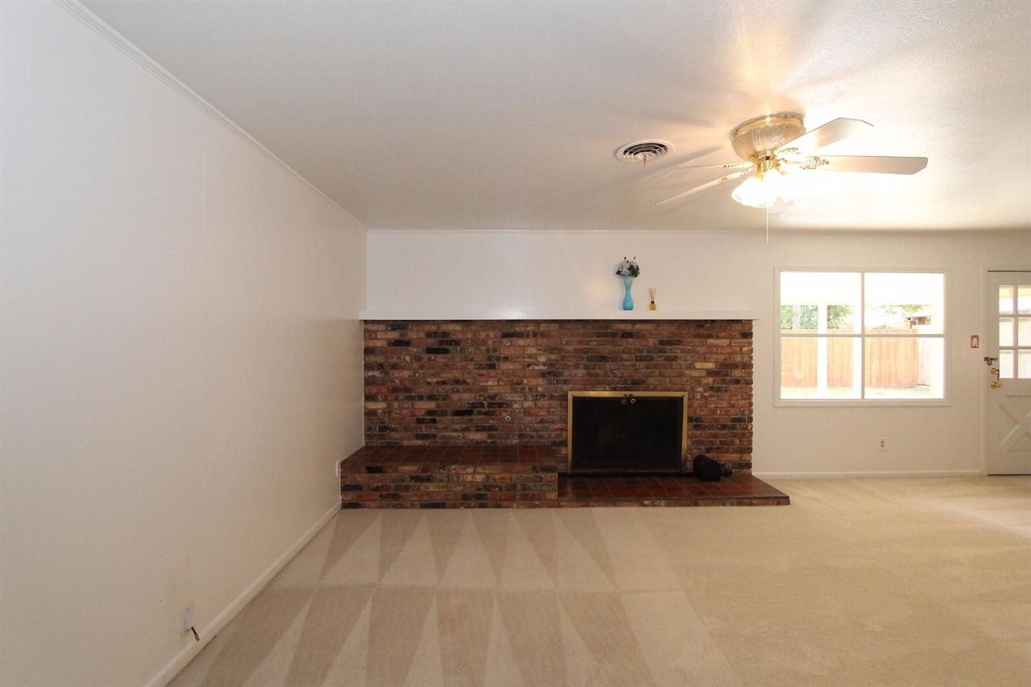 4711 27th Street Lubbock, TX 79410 - Photo 6 of 10 a living room with furniture and a fireplace