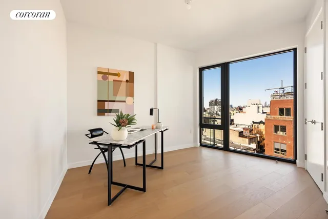 a view of a workspace with furniture