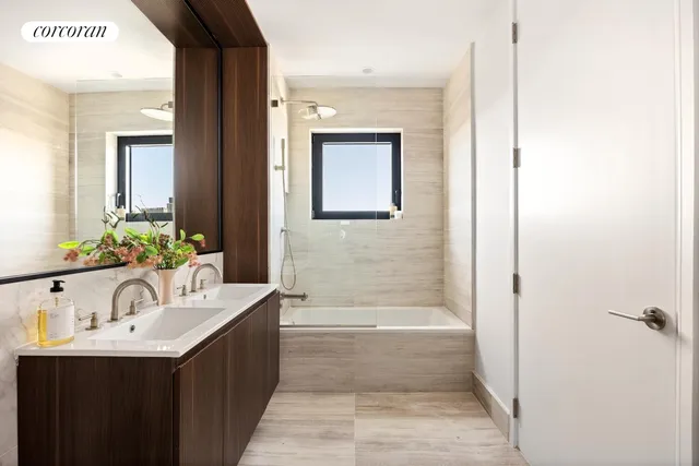 a bathroom with a bathtub and a sink
