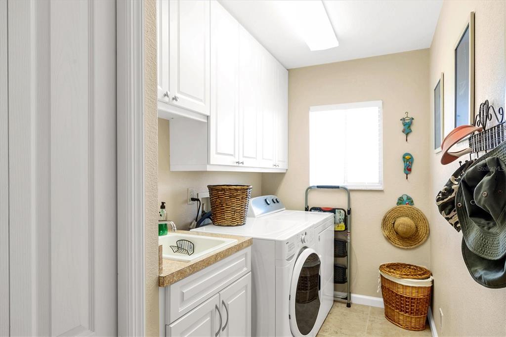14091 Peekskill Avenue Port Charlotte, FL 33981 - Photo 26 of 53 a utility room with sink dryer and washer