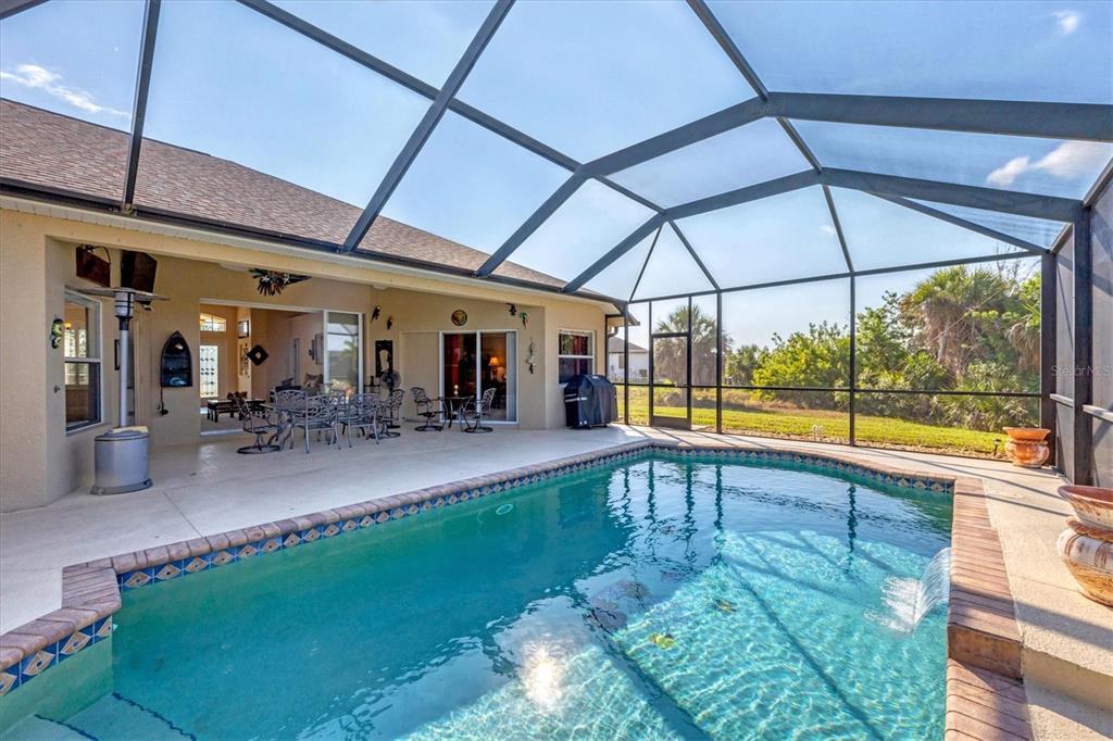 14091 Peekskill Avenue Port Charlotte, FL 33981 - Photo 30 of 53 a view of a swimming pool with a patio