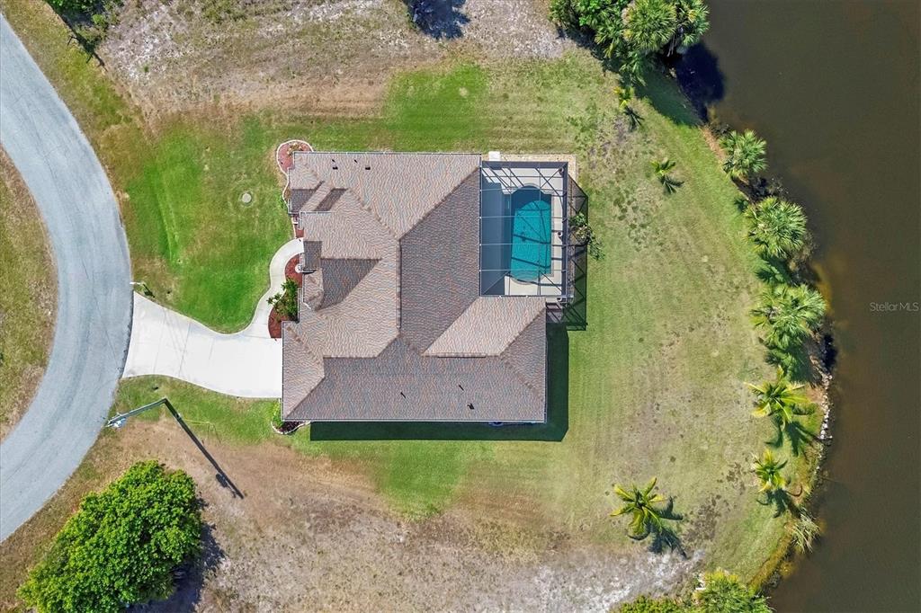 14091 Peekskill Avenue Port Charlotte, FL 33981 - Photo 36 of 53 an aerial view of a house with a garden