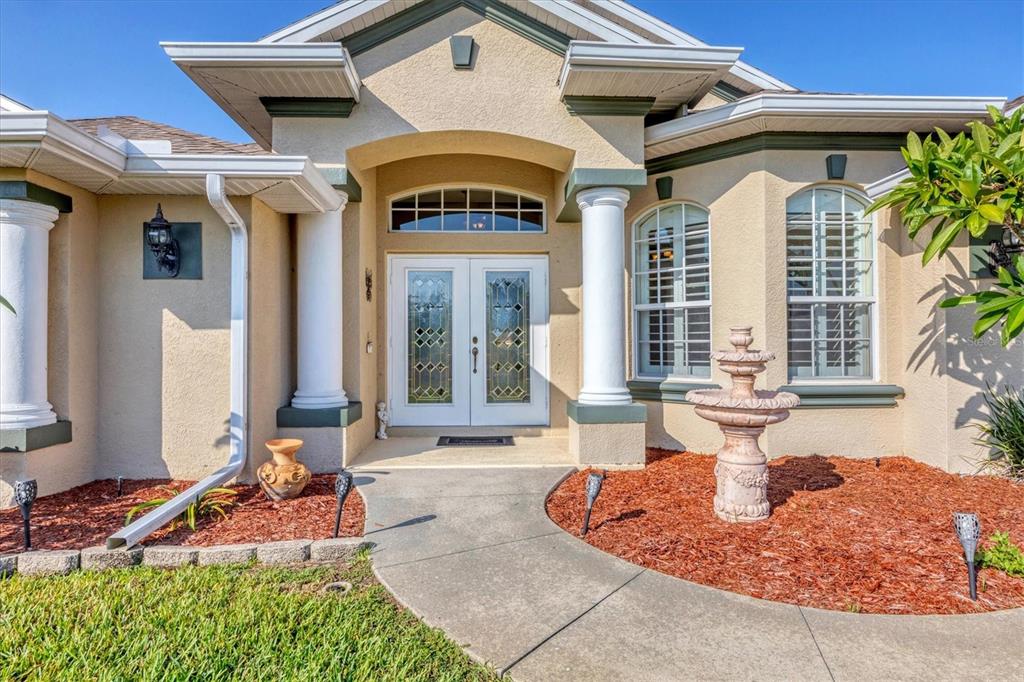 14091 Peekskill Avenue Port Charlotte, FL 33981 - Photo 4 of 53 a front view of a house with garden