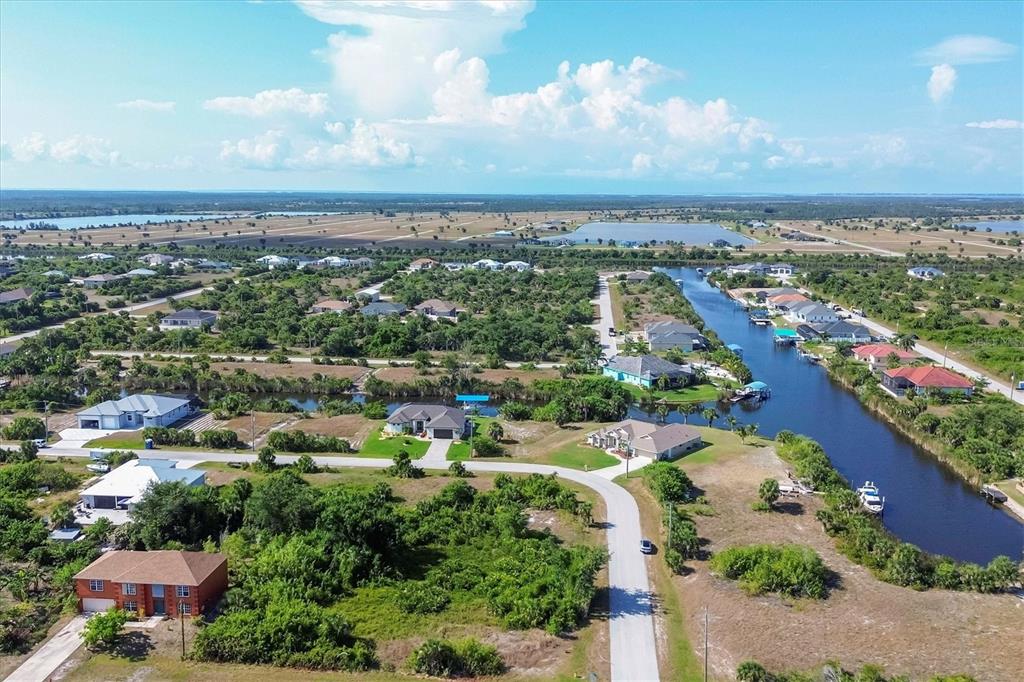 14091 Peekskill Avenue Port Charlotte, FL 33981 - Photo 42 of 53 an aerial view of residential building and lake