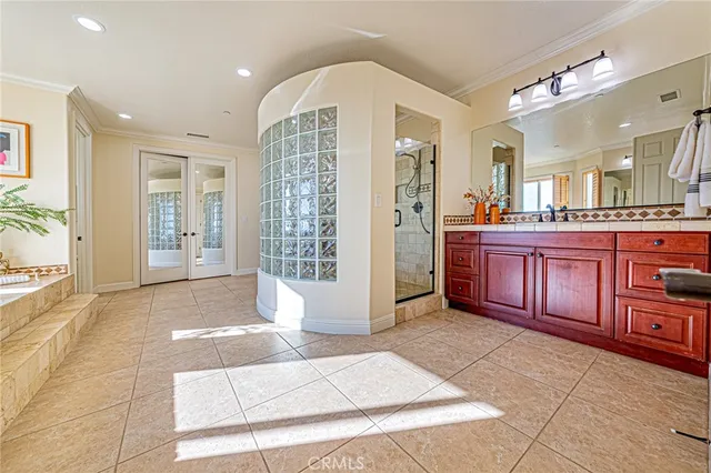 a bathroom with a double vanity sink and a mirror