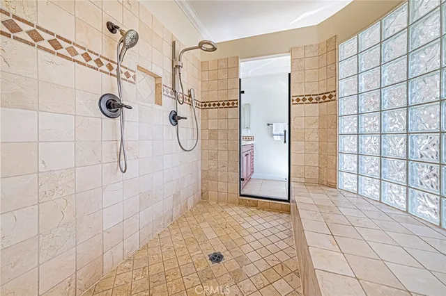 a bedroom with a bed and a potted plant