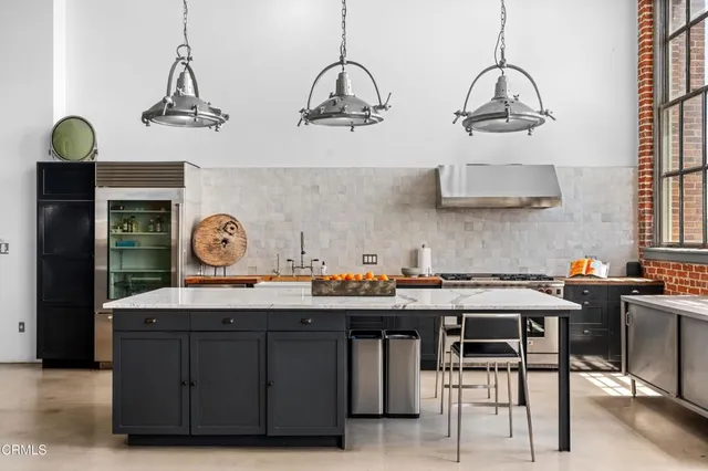 a kitchen with a stove and cabinets