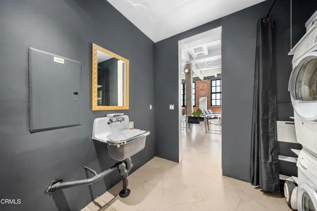 a bathroom with a sink mirror and toilet