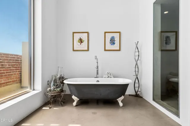 a spacious bathroom with a double vanity sink and a window