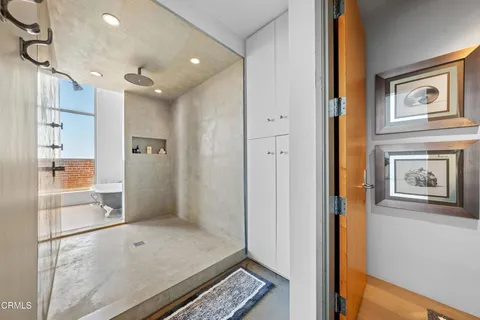 a view of hallway with livingroom and glass door