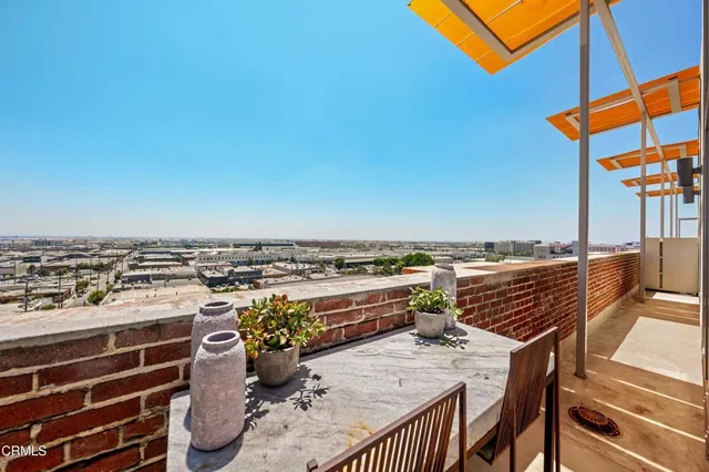 a view of roof deck with patio