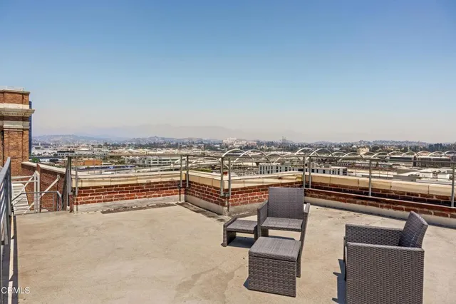 a kitchen view living space with furniture and wooden floor