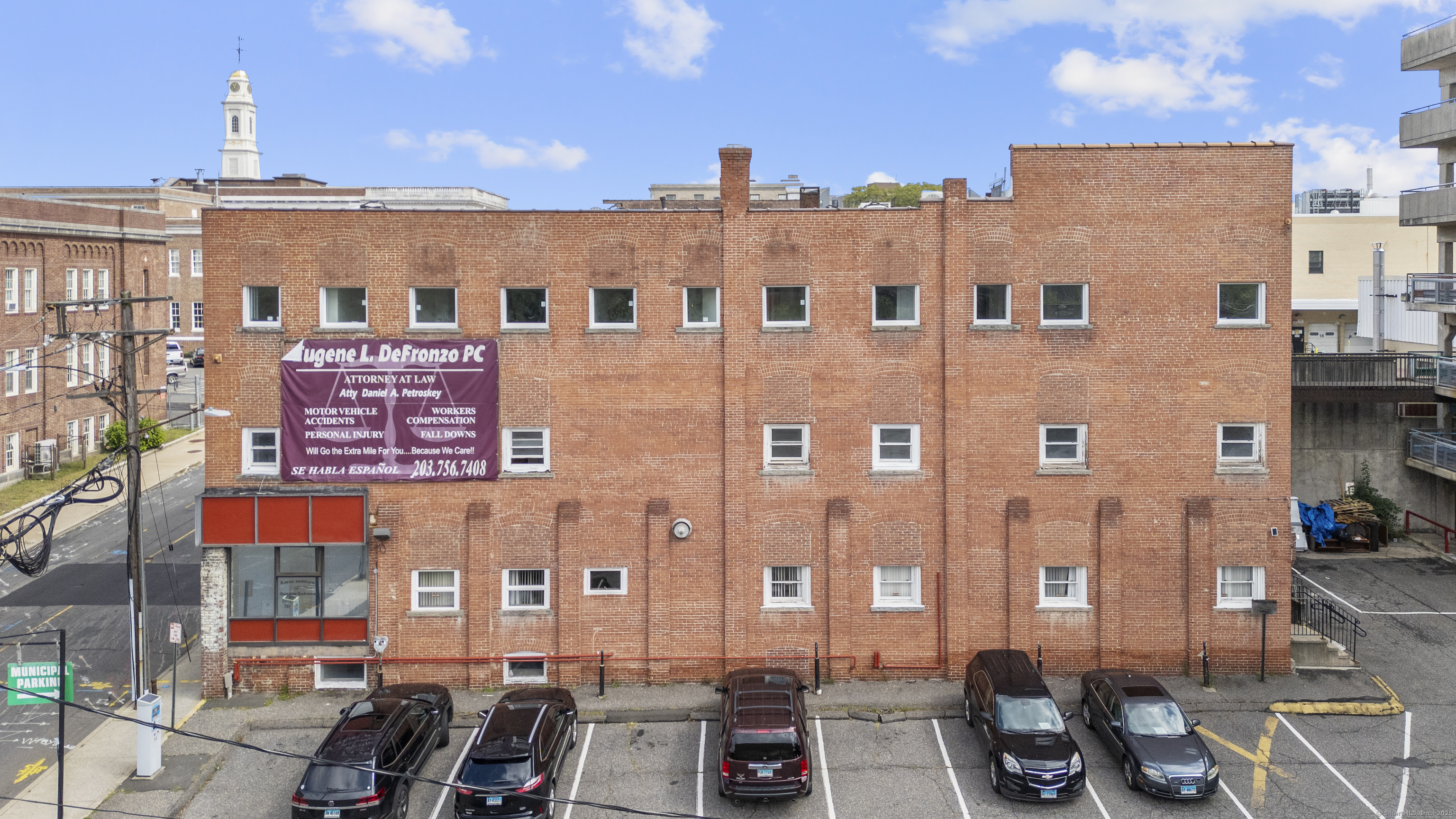 61 Field Street, Unit 211 Waterbury, CT 06702 - Photo 8 of 11 a view of a building with many windows