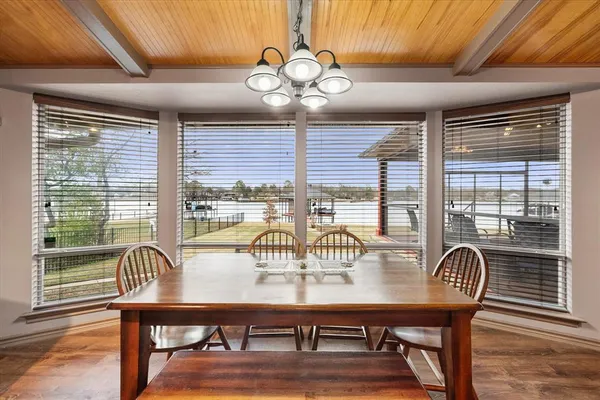 a view of a dining room with furniture window and outside view