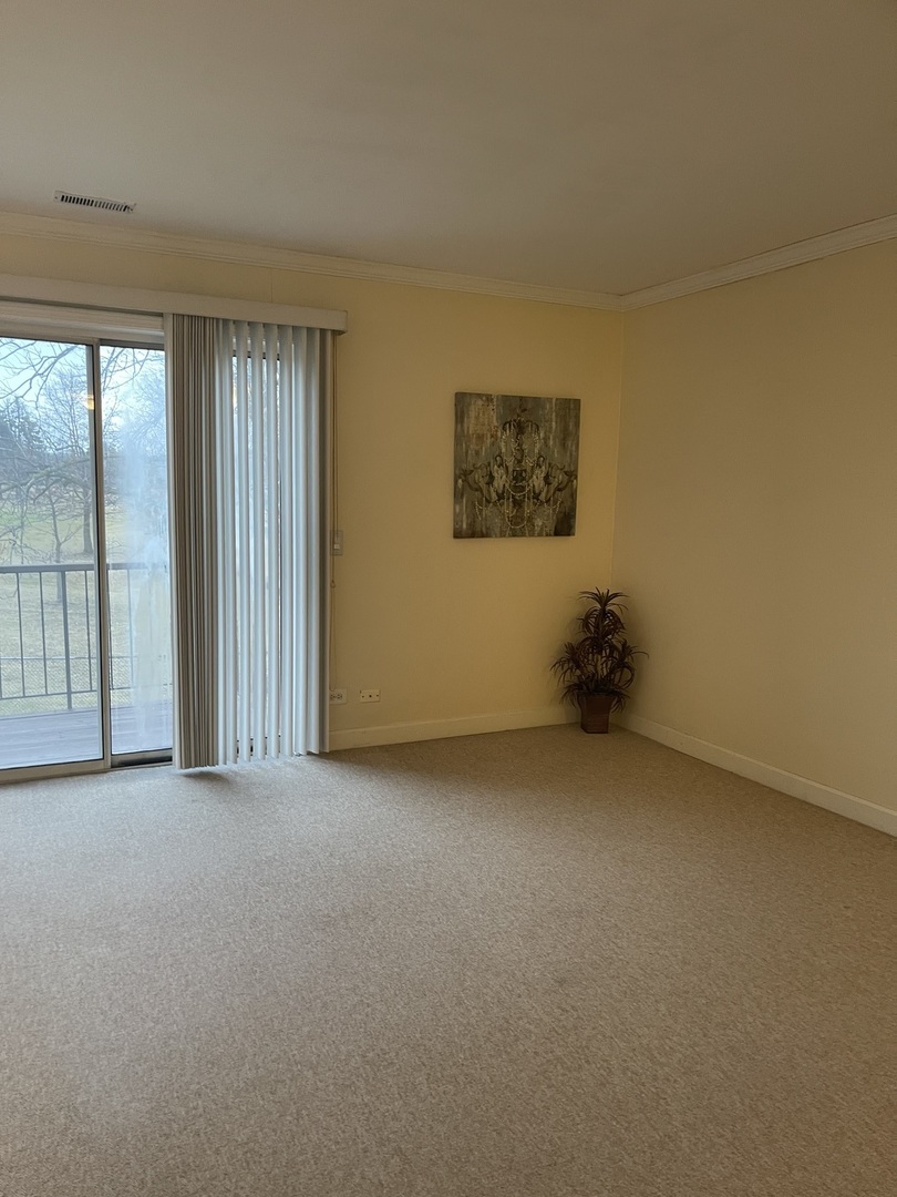 245 Memory Lane, Unit 3 Westmont, IL 60559 - Photo 11 of 28 an empty room with windows
