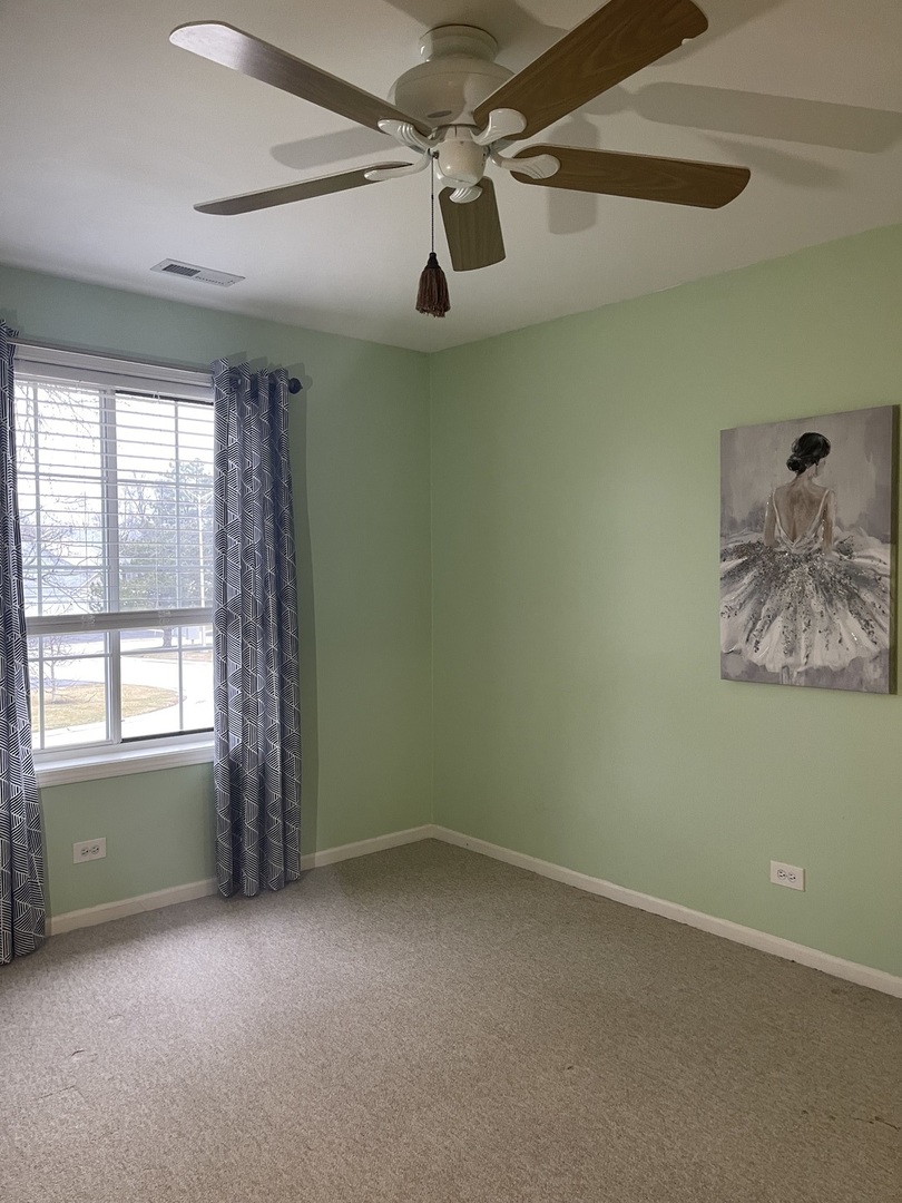 245 Memory Lane, Unit 3 Westmont, IL 60559 - Photo 12 of 28 an empty room with windows