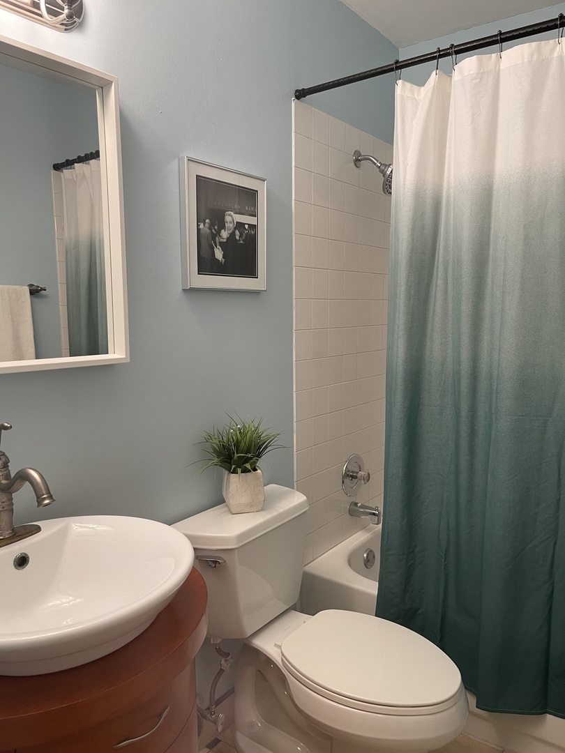 245 Memory Lane, Unit 3 Westmont, IL 60559 - Photo 23 of 28 a white toilet sitting next to a bathroom sink