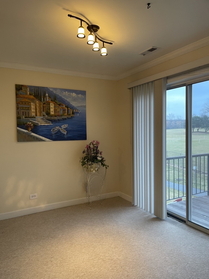 245 Memory Lane, Unit 3 Westmont, IL 60559 - Photo 9 of 28 a view of a room with a large window