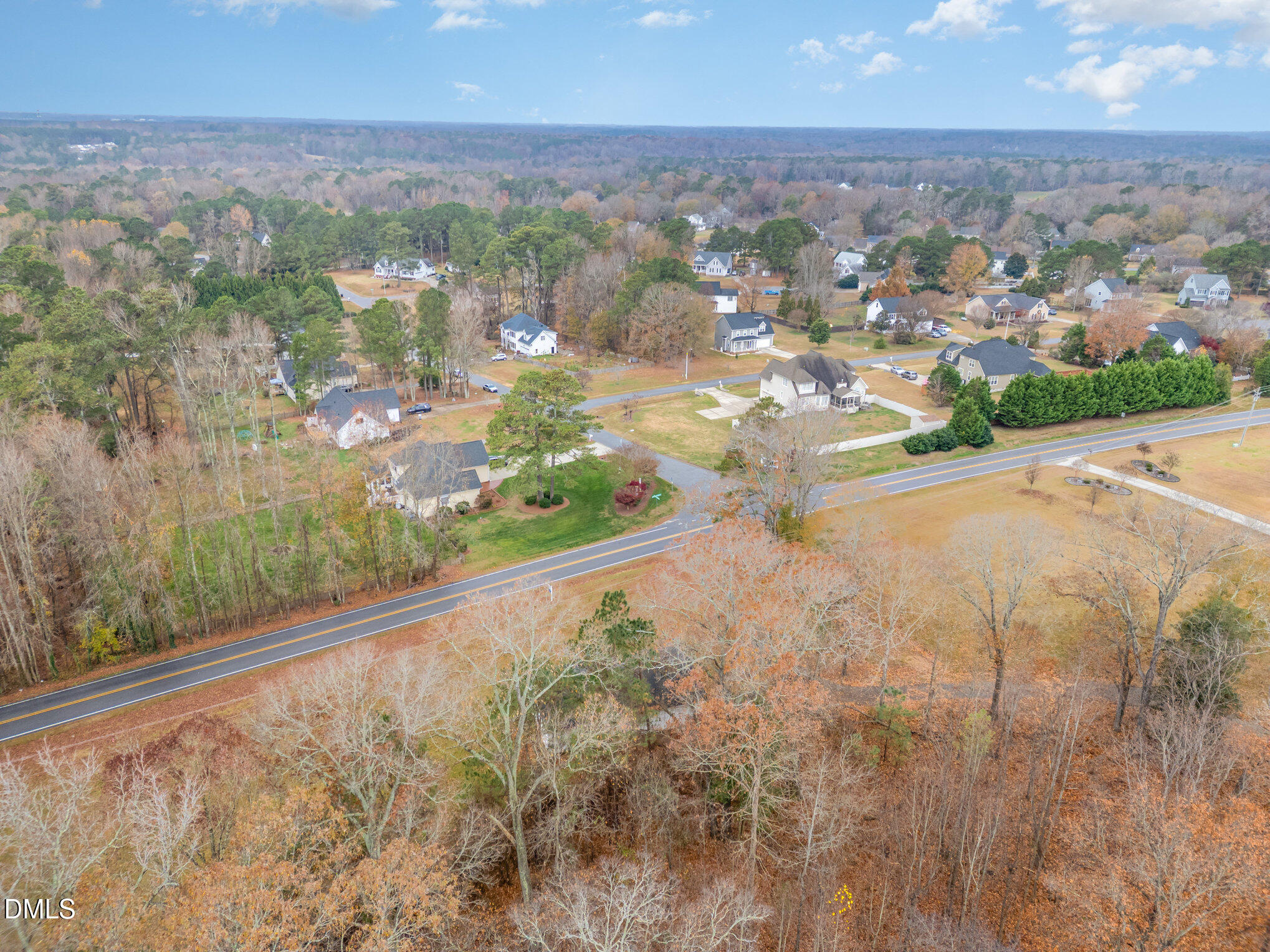 6801 Rock Service Station Road Raleigh, NC 27603 - Photo 13 of 36 an aerial view of residential houses with city view