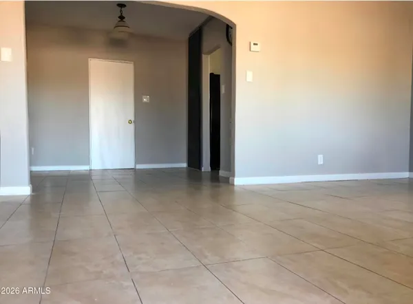 a kitchen with cabinets and window