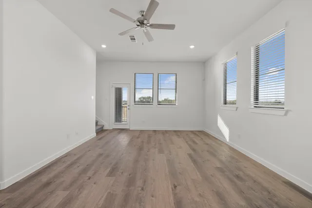 a view of kitchen with wooden floor and window