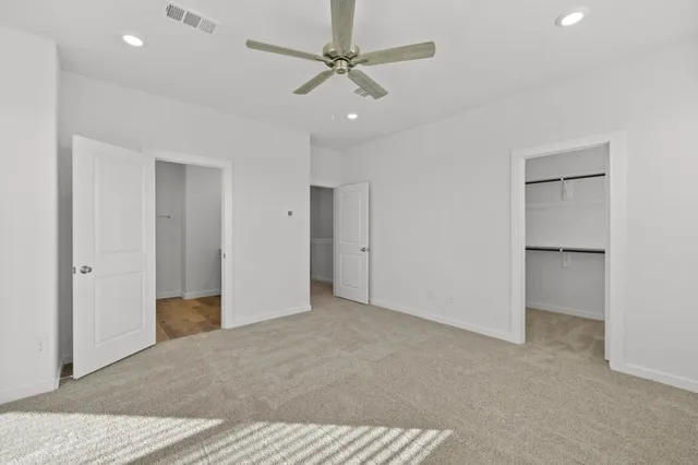 a view of a bathroom with a glass shower door