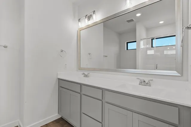 a view of a lake with a houses in the background