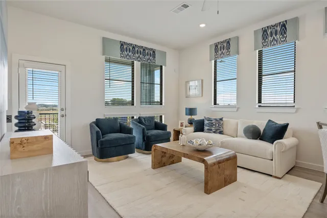 a living room with furniture and a large window