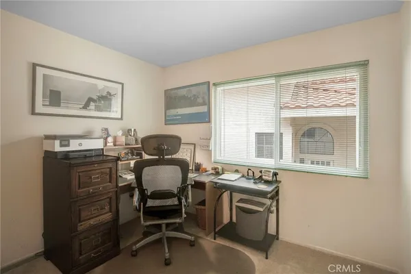 a workspace with furniture and window