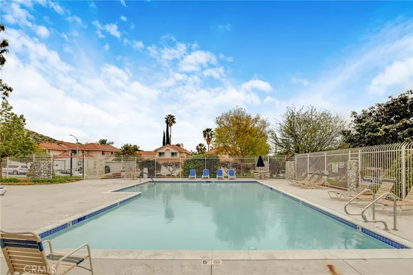 a view of swimming pool with a yard