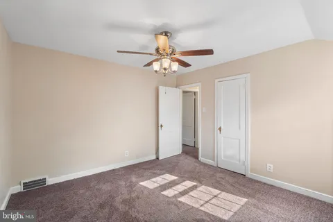 a view of a chandelier fan in a room