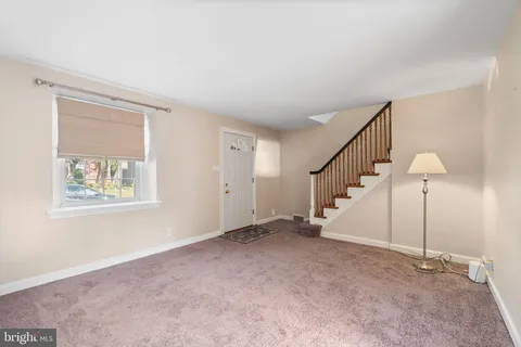 a view of an empty room with stairs