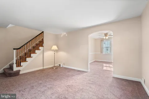 a view of an empty room with stairs