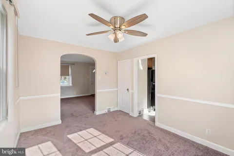 a view of a livingroom with a ceiling fan