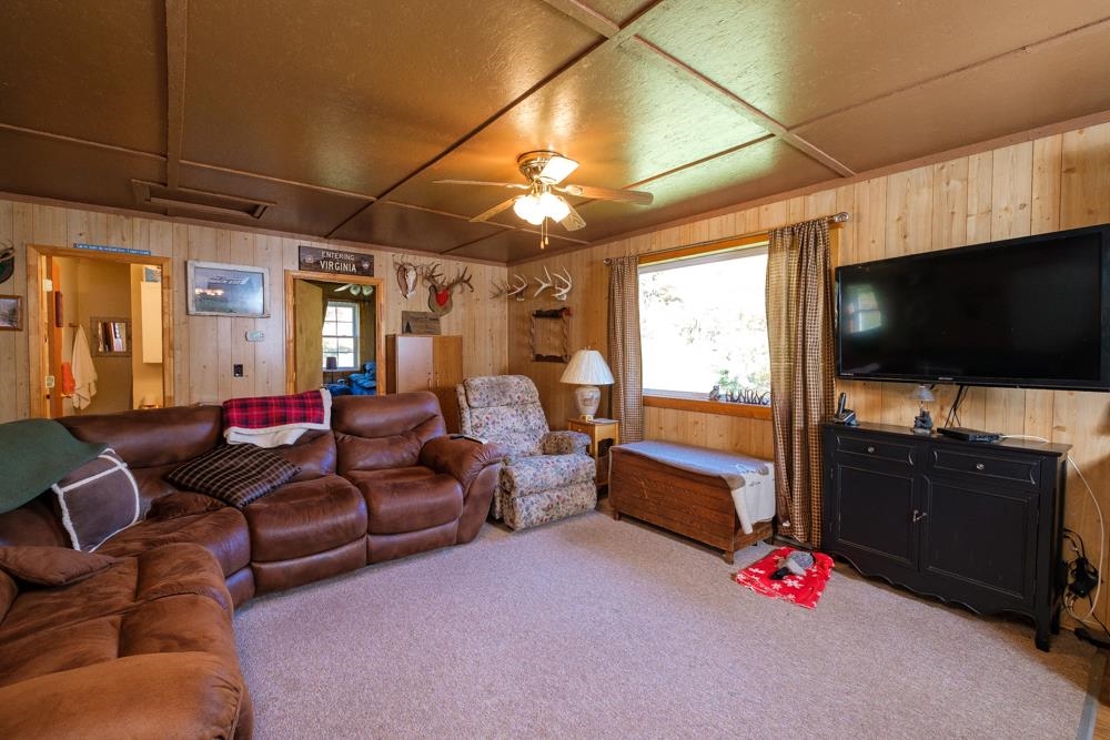 23215 Bennett Run Road Bergton, VA 22811 - Photo 16 of 19 a living room with furniture and a flat screen tv