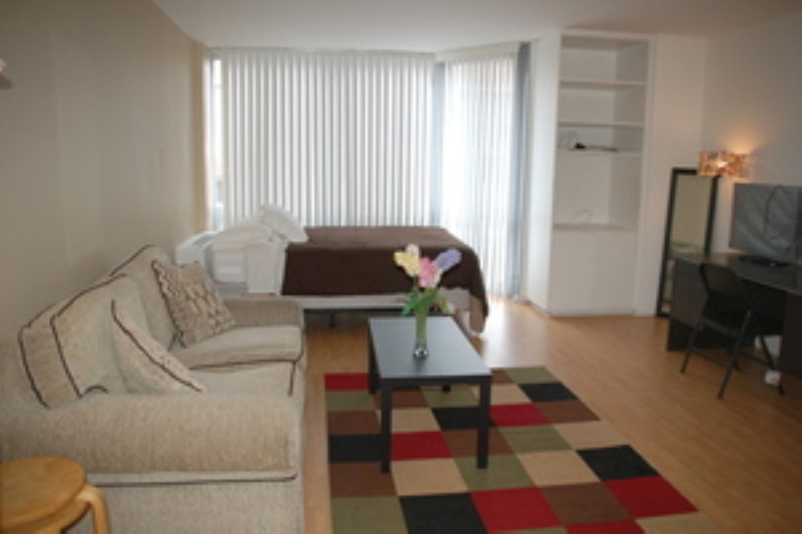 21 West Goethe Street, Unit 7C Chicago, IL 60610 - Photo 4 of 24 a living room with furniture and a rug
