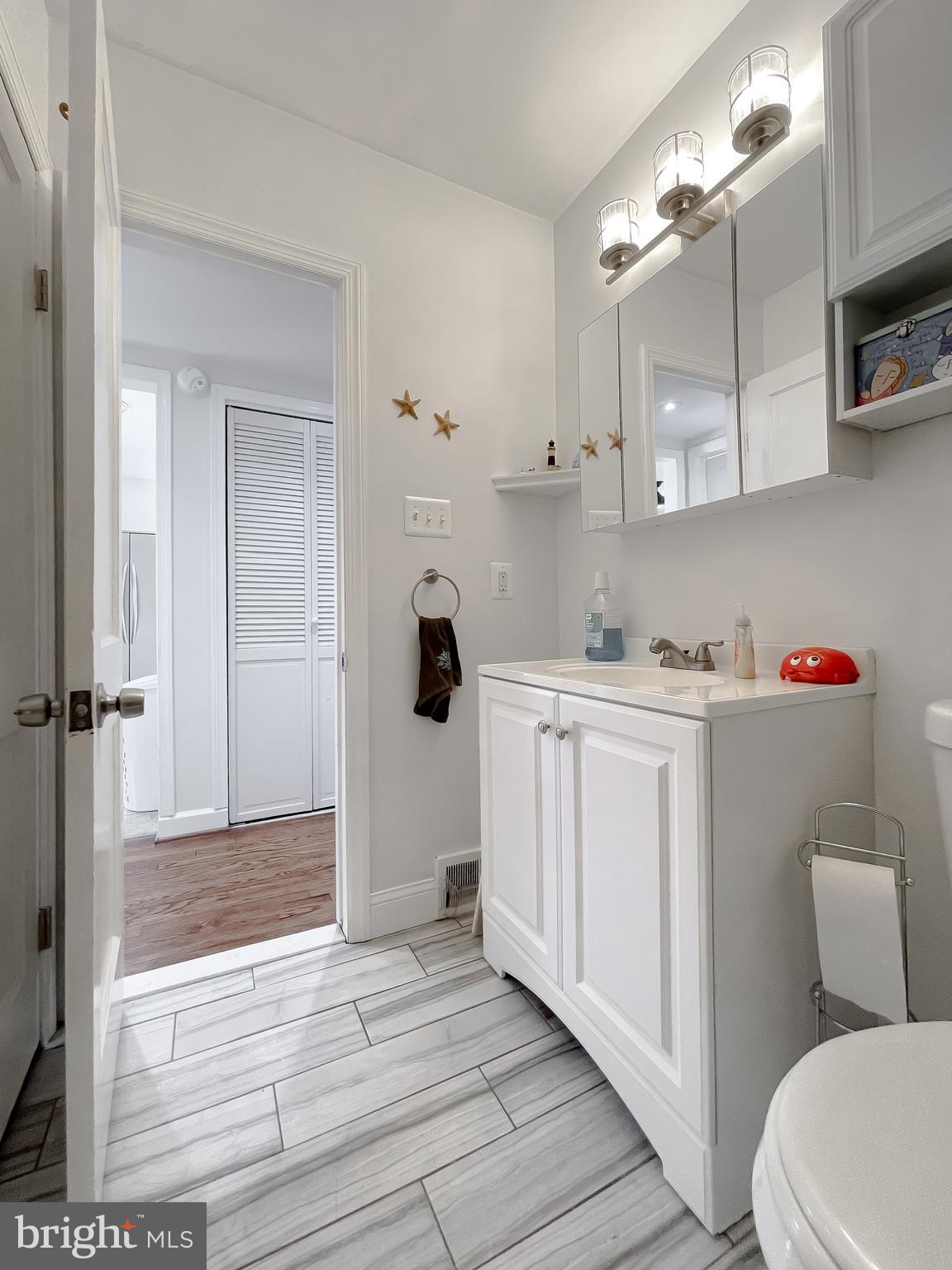 31 Governor's Gate Lane Linthicum, MD 21090 - Photo 23 of 34 a bathroom with a sink a toilet and shower