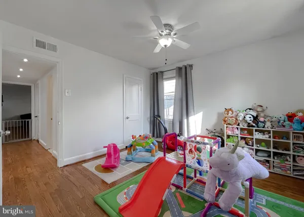 a bedroom with furniture and a chandelier