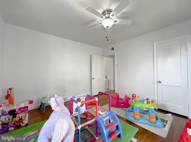 a living room with baby toys