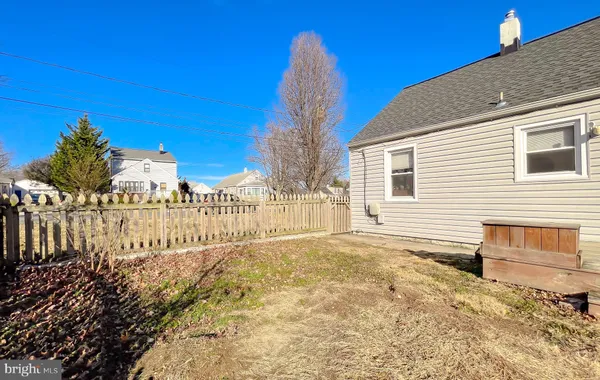 a view of a backyard of the house