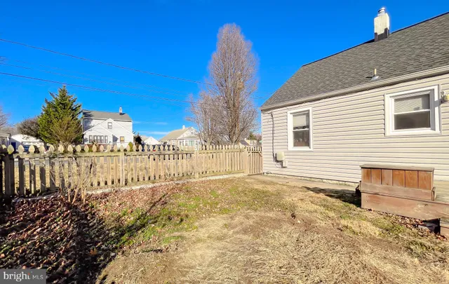 a view of a backyard of the house