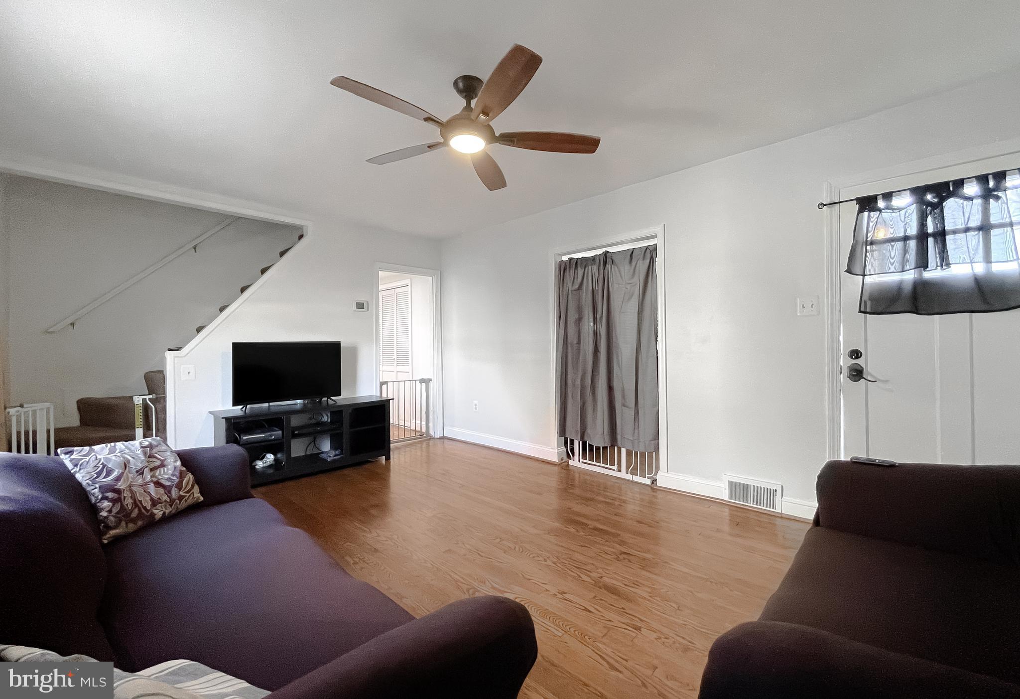 31 Governor's Gate Lane Linthicum, MD 21090 - Photo 4 of 34 a living room with furniture and a flat screen tv