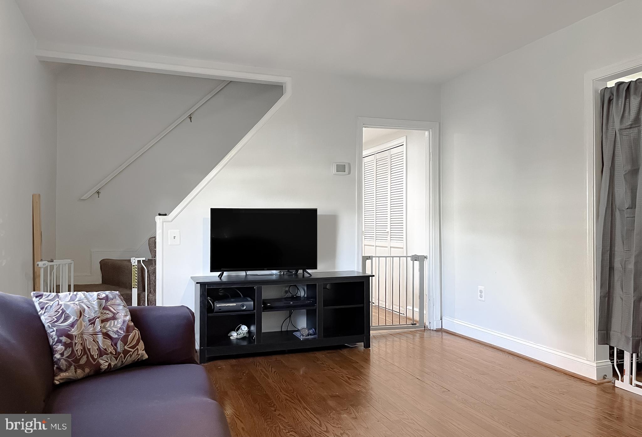31 Governor's Gate Lane Linthicum, MD 21090 - Photo 5 of 34 a living room with furniture and a flat screen tv